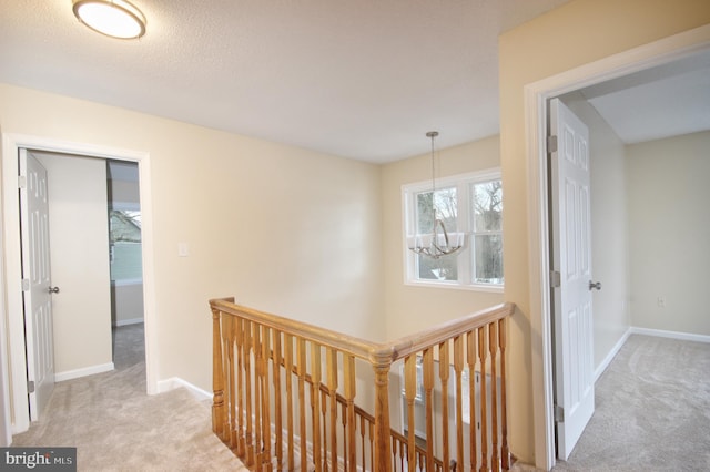 corridor with light colored carpet