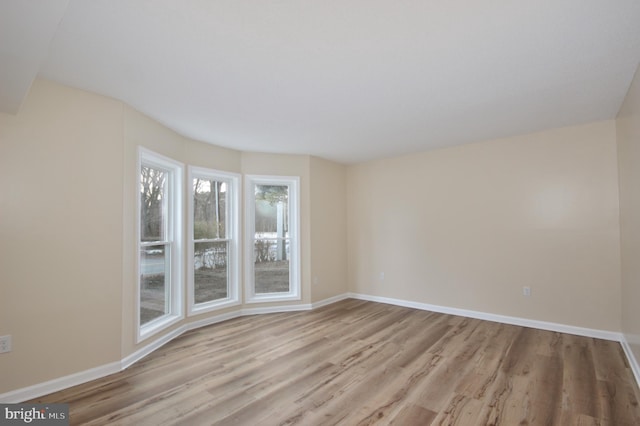 empty room with light hardwood / wood-style floors