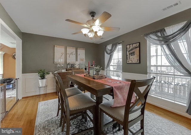 dining room featuring light hardwood / wood-style flooring and ceiling fan