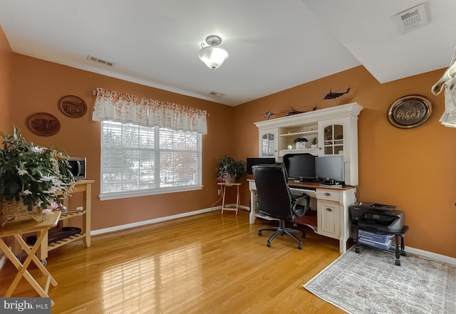 home office featuring light hardwood / wood-style floors