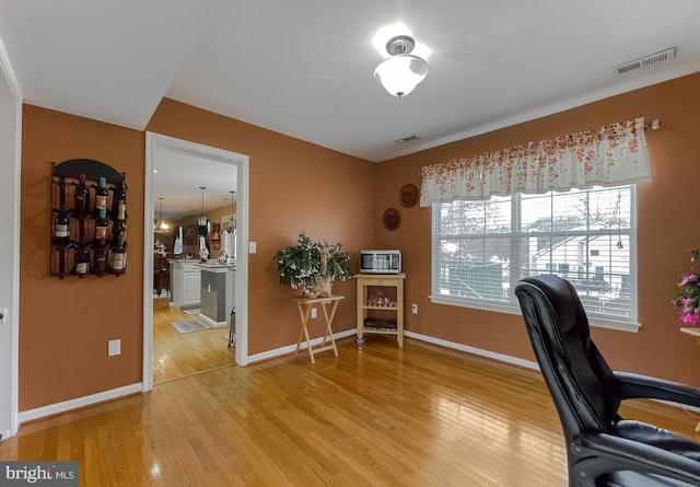 office space with light wood-type flooring