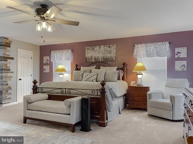 carpeted bedroom featuring ceiling fan