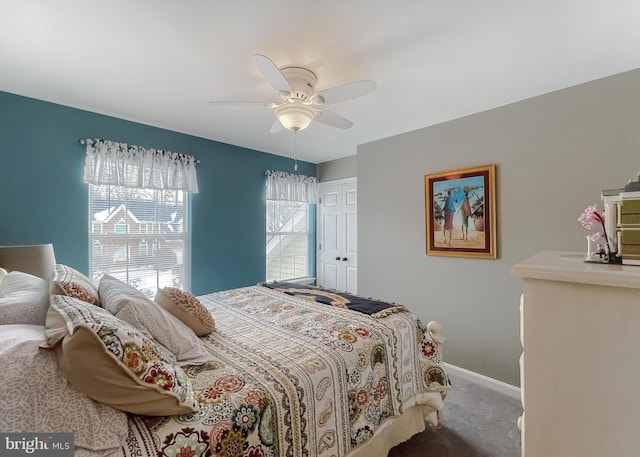 carpeted bedroom with a closet and ceiling fan