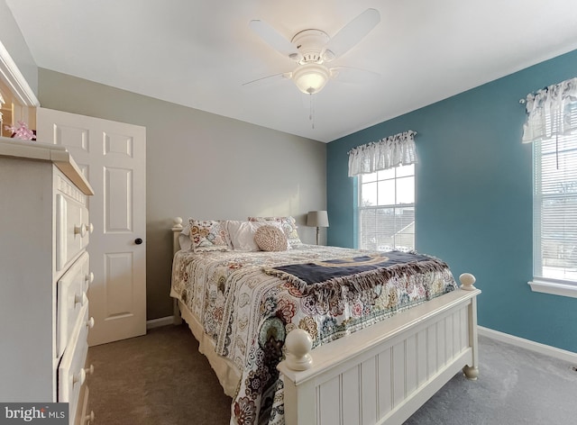 bedroom with ceiling fan and dark carpet