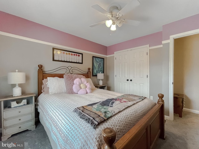 bedroom featuring ceiling fan, dark carpet, and a closet