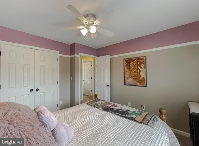 bedroom featuring ceiling fan and a closet