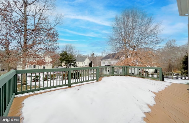 view of snow covered deck