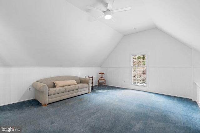 additional living space with vaulted ceiling, ceiling fan, and dark carpet