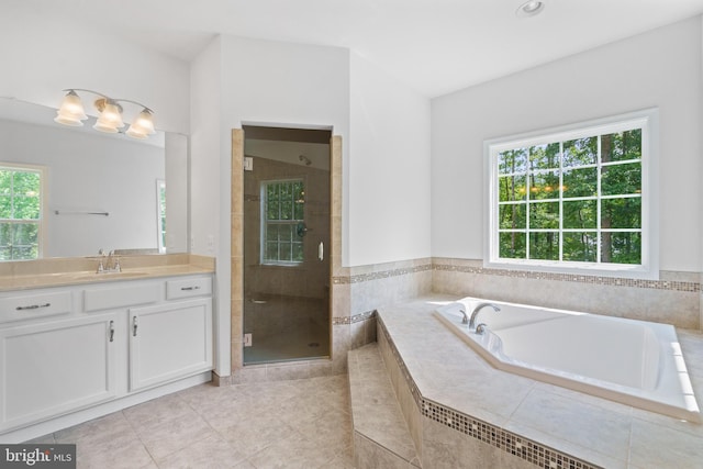 bathroom featuring vanity, independent shower and bath, and tile patterned floors