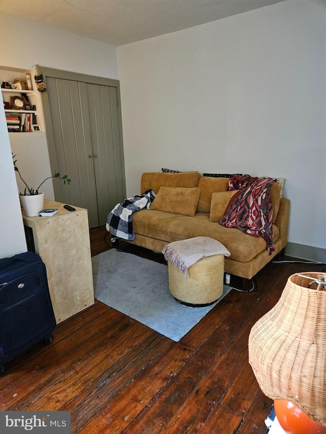 living room featuring dark wood-type flooring