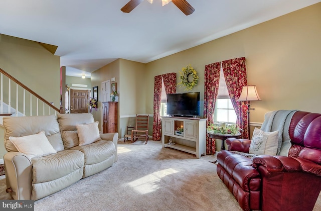 carpeted living room featuring ceiling fan