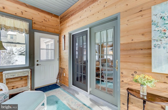 doorway featuring wood walls