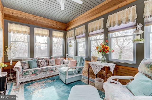 sunroom / solarium with ceiling fan and a healthy amount of sunlight