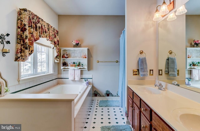 bathroom featuring vanity and a bath