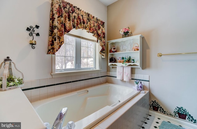 bathroom with tiled tub