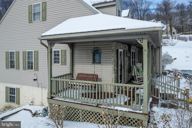 view of snow covered house