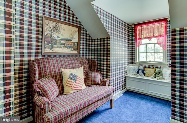 living area featuring carpet and lofted ceiling