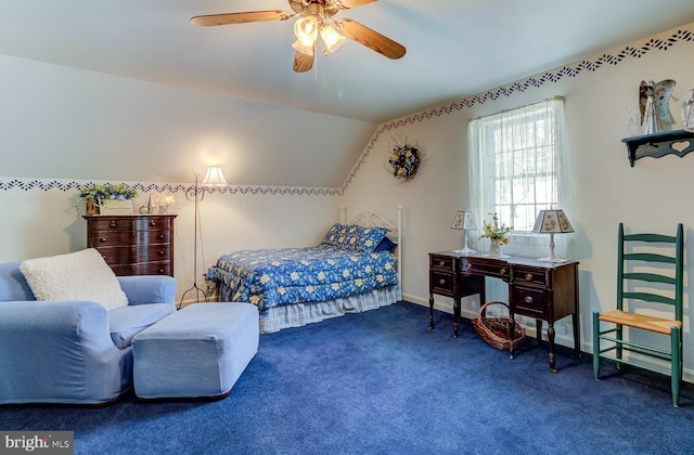 carpeted bedroom featuring ceiling fan and vaulted ceiling