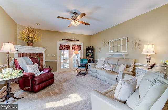 living room with ceiling fan and light colored carpet