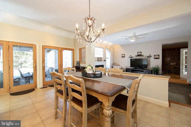 dining room with ceiling fan and light tile patterned floors