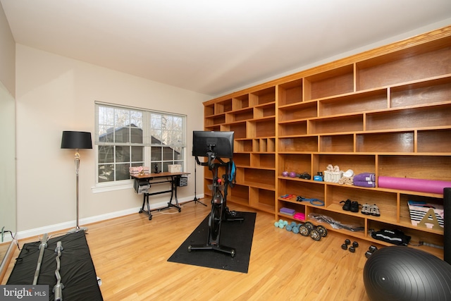 workout room with hardwood / wood-style floors