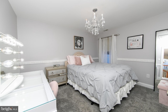 carpeted bedroom with a chandelier