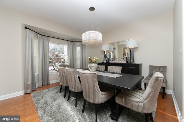 dining area with light hardwood / wood-style flooring