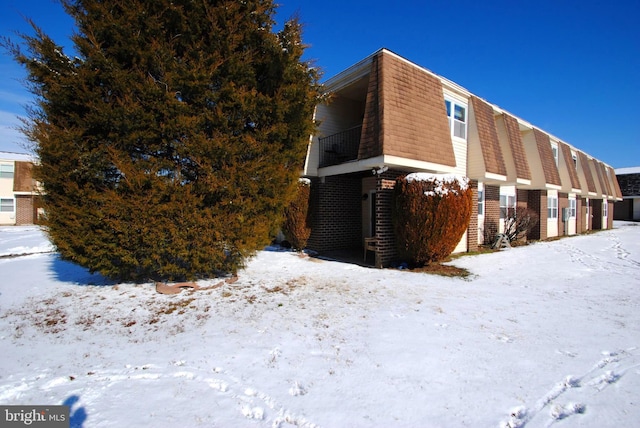 view of snow covered property