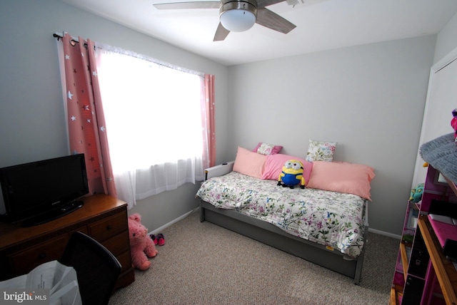 bedroom with ceiling fan and carpet flooring