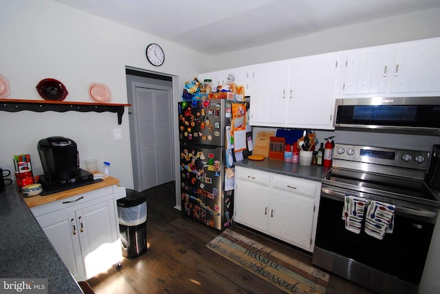 kitchen featuring dark hardwood / wood-style flooring, white cabinetry, and appliances with stainless steel finishes