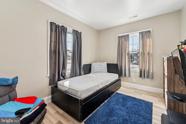 bedroom with light hardwood / wood-style floors