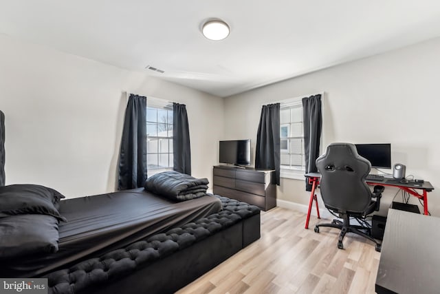 bedroom with light wood-type flooring