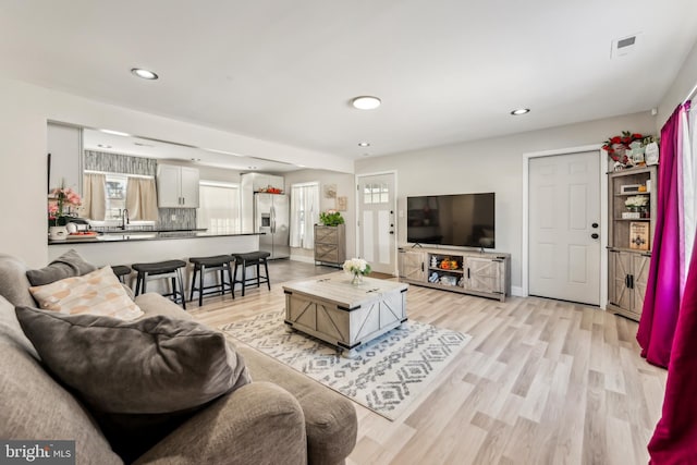 living room with light hardwood / wood-style floors