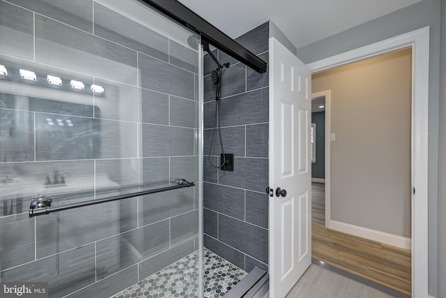 bathroom featuring an enclosed shower