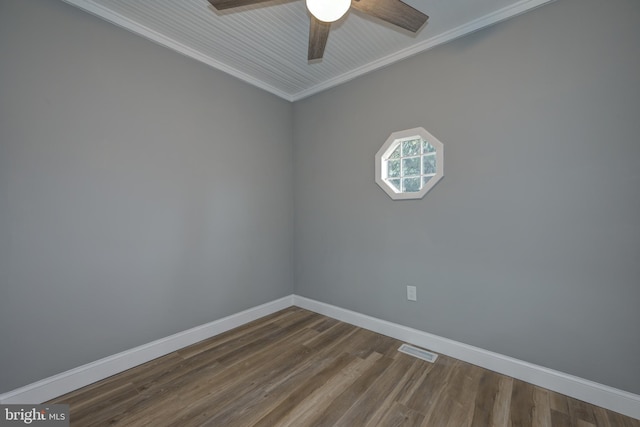 empty room featuring ceiling fan, ornamental molding, and hardwood / wood-style floors