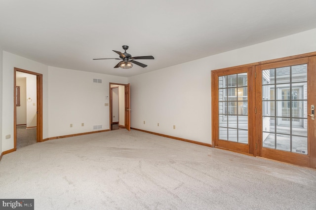 carpeted empty room with ceiling fan