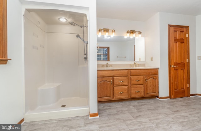 bathroom with vanity and walk in shower