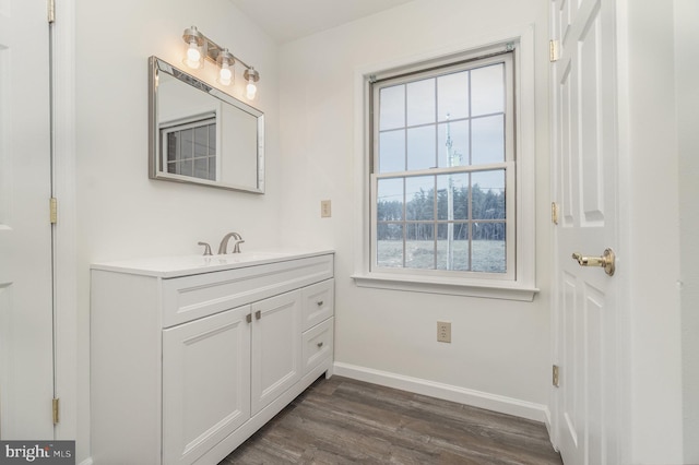 bathroom with hardwood / wood-style floors and vanity