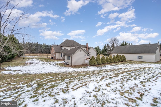 view of snow covered house