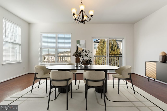 dining area with light hardwood / wood-style flooring and a wealth of natural light