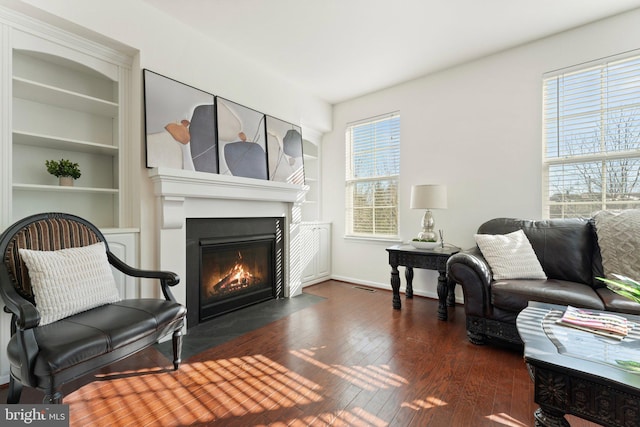 sitting room featuring dark hardwood / wood-style flooring