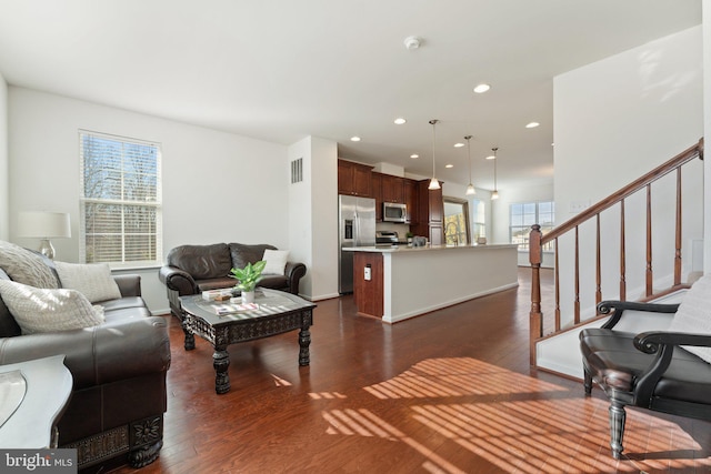 living room featuring dark hardwood / wood-style flooring