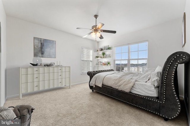 carpeted bedroom with ceiling fan