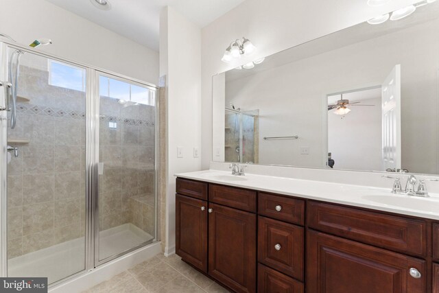 bathroom with vanity, walk in shower, and tile patterned floors