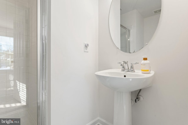 bathroom featuring walk in shower