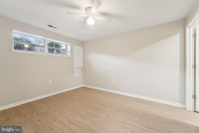 unfurnished room with ceiling fan and light wood-type flooring