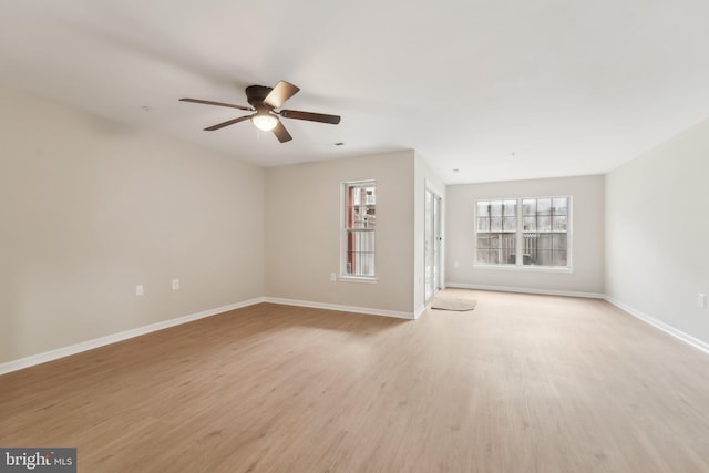 unfurnished living room featuring ceiling fan and light hardwood / wood-style floors