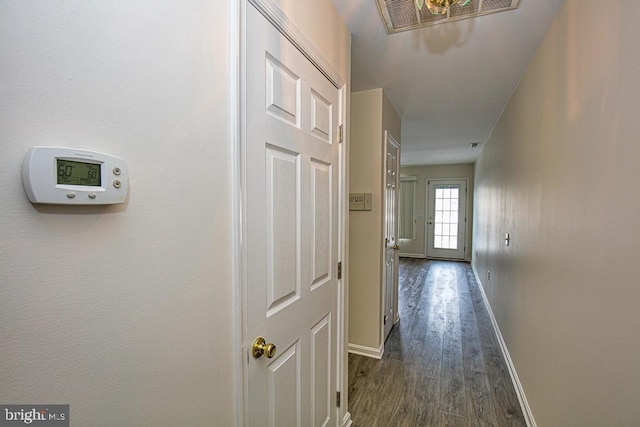 corridor featuring dark hardwood / wood-style floors