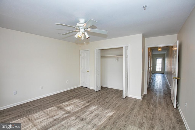 unfurnished bedroom with hardwood / wood-style flooring and ceiling fan