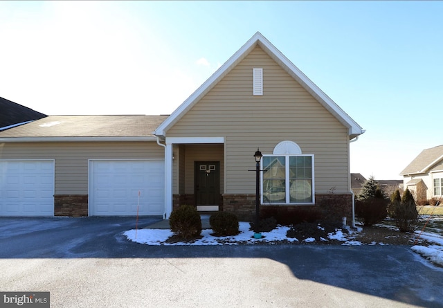 148 Gemstone Dr, Bellefonte, PA 16823 - view of front of home with aphalt driveway and an attached garage